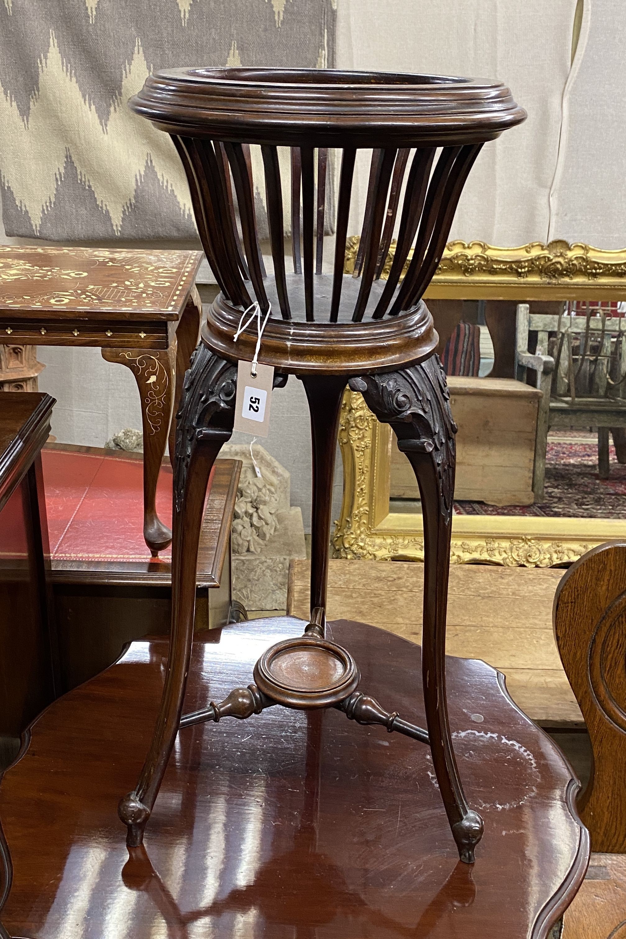 A late Victorian carved mahogany jardiniere, no liner, diameter 36cm, height 82cm